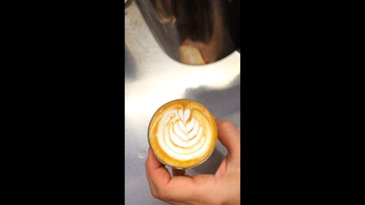 Tiny Tulips latte art in an espresso cup for a short macchiato topped up coffee
