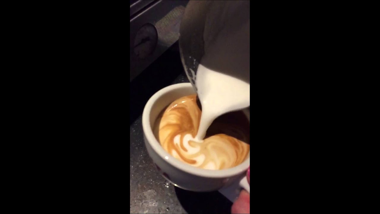 Making a flat white at work, slow motion (Costa Coffee)