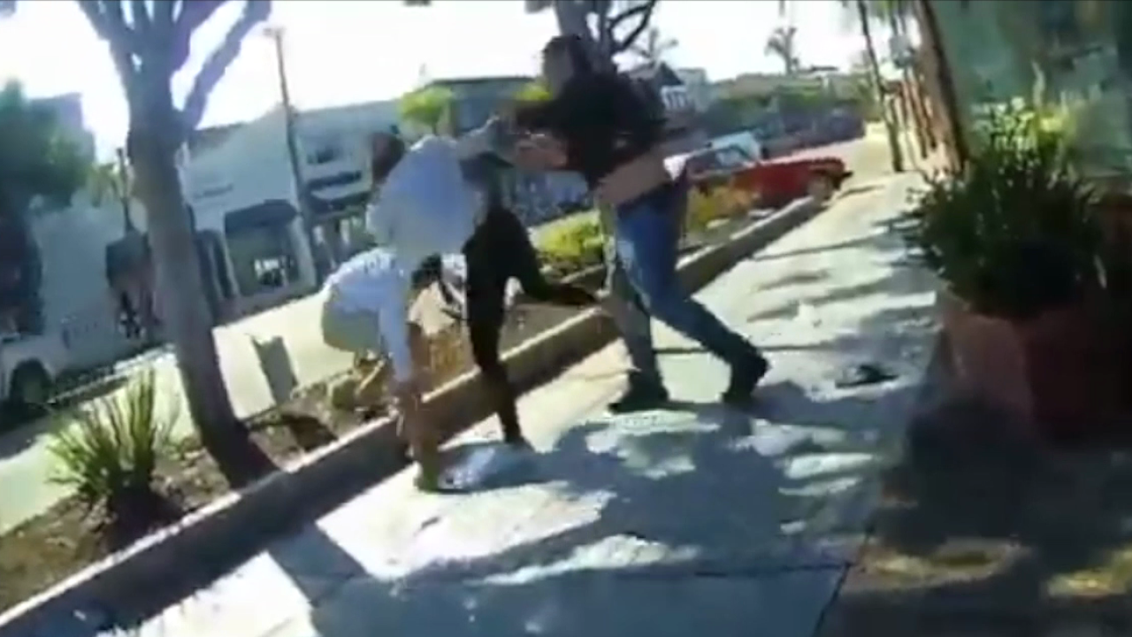 Video shows fight breaking out after woman throws coffee at man not wearing mask