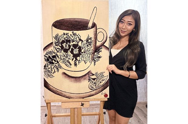 Artist with a heart puts coffee waste to good use